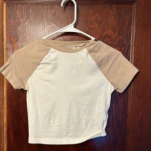 Baby tee, slightly see through on the white part.